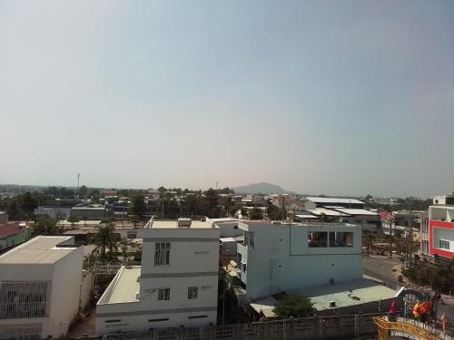 an overhead view of a city with buildings at Hostel Đặng Lợi ホステルダンロイ in Chau Doc
