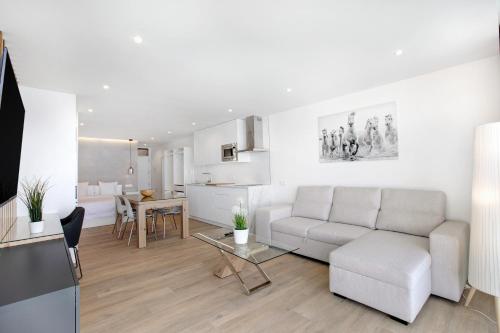 a living room with a couch and a table at Luxury Loft El Roque 1 in Tacoronte