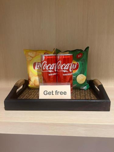 a shelf with endorsed food and drinks on it at THE HUB SURATTHANl in Surat Thani