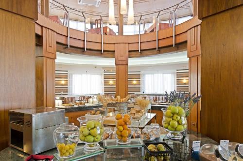 a lobby with a bunch of fruit on a table at Elba Lucía Sport & Suite Hotel in Costa de Antigua