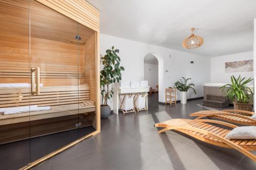 a bedroom with a bed and a table in a room at Holiday Home & Spa Kozji Vrh in Čabar
