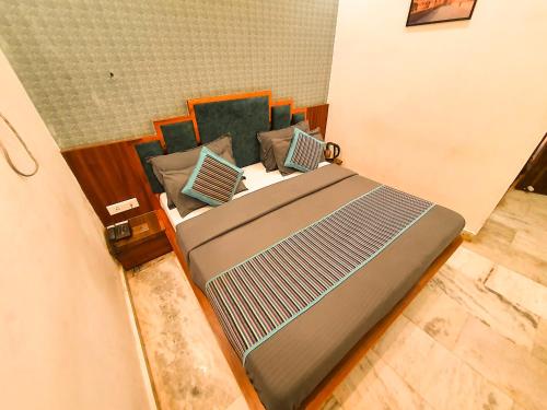 a large bed in a room with at The Vacation Villa in Agra