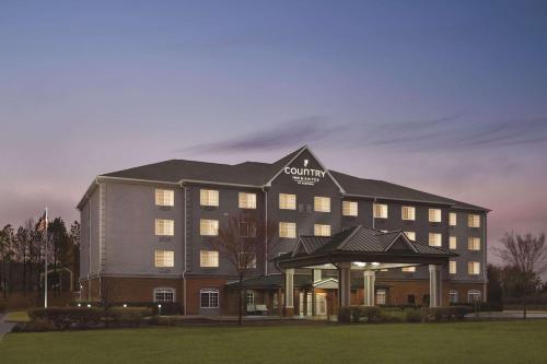 a hotel building with a gazebo in front of it at Country Inn & Suites by Radisson, Homewood, AL in Birmingham