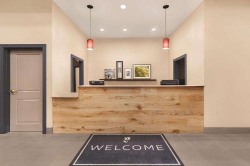 a welcome mat in a lobby with a welcome counter at Country Inn & Suites by Radisson, Homewood, AL in Birmingham