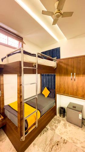 two bunk beds in a room with a ceiling at The Vacation Villa in Agra