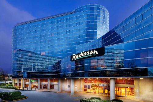 a building with a sign on the front of it at Radisson Hotel Vancouver Airport in Richmond