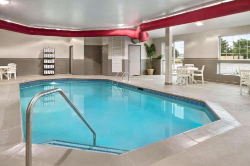 a large pool in a hotel room with at Country Inn & Suites by Radisson, Manteno, IL in Manteno