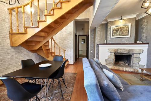 a living room with a couch and a table at Iliani Hotel in Tbilisi City