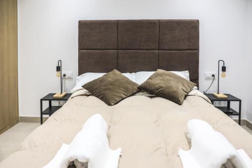 Posteľ alebo postele v izbe v ubytovaní Apartamentos Sudestada