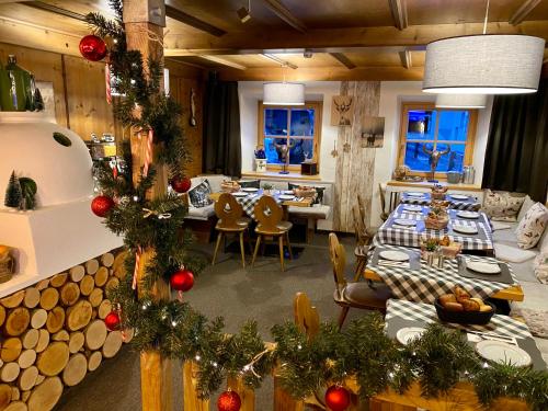 a dining room with a table and christmas decorations at Haus Tirol Ehrwald in Ehrwald
