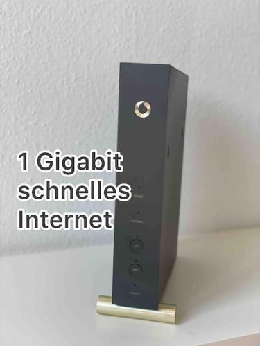 a black remote control sitting on top of a wall at Skyline Appartement mit Pool and Netflix in Kronberg im Taunus