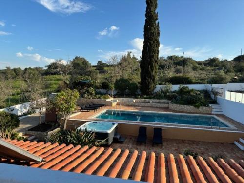 a swimming pool on the roof of a house at Villa GALVANA in Guia
