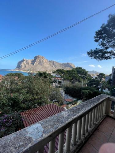 a balcony with a view of a mountain at FINESTRA SUL MARE in Palermo