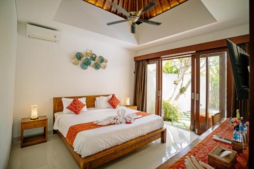Ένα ή περισσότερα κρεβάτια σε δωμάτιο στο Villa Branka Sanur