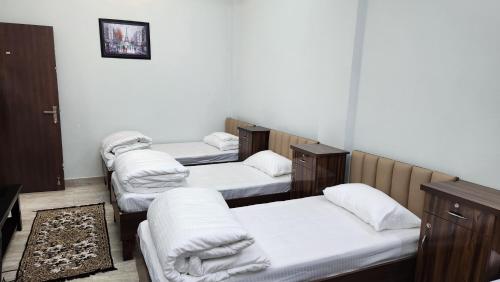 מיטה או מיטות בחדר ב-NANDI RETREAT HomeStay