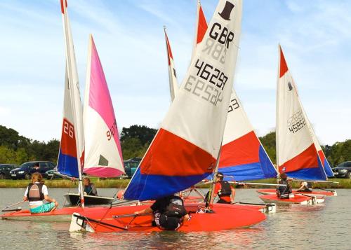 a group of sailboats sitting in the water at Bosworth Lakeside Lodges 