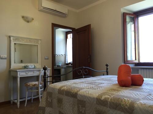 En eller flere senge i et værelse på La Cortevecchia