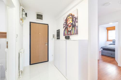 a hallway with a door in a white room at Arvia Apartment in Zagreb