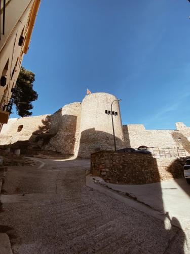 a tall building with a blue sky in the background at Casa Cardona in Móra d'Ebre