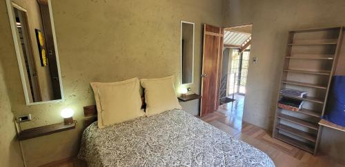Säng eller sängar i ett rum på Casa Campestre Santa Emilia Lodge