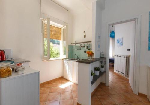 a kitchen with a counter and a window in it at Residence Le Terrazze in Sorrento