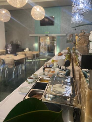a buffet line with food in a restaurant at Malkia Penzion in Orechová Potôň
