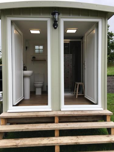 two windows on the front of a tiny house at Willow Pod in Great Ayton