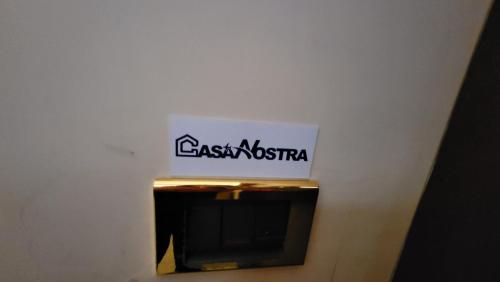 a sign that says east australia on a wall at Casa nostra aeroporto e mare in Fiumicino