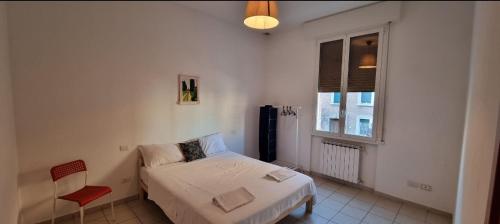 A bed or beds in a room at Bolognina Apartments