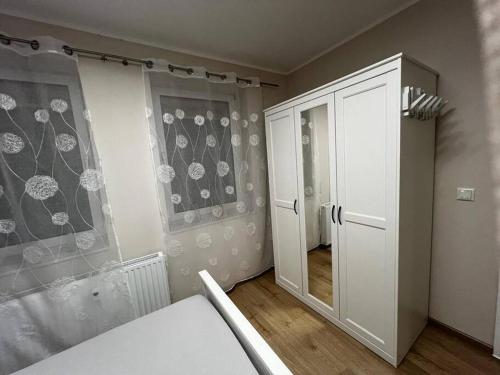 a room with a bed and a door to a bedroom at Boarding House "Alte Schusterei" am Ahnepark in Vellmar
