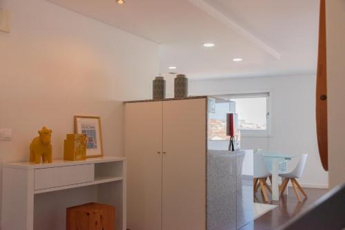 a living room with a cabinet and a table at North Star Flats @Santa Marinha in Vila Nova de Gaia