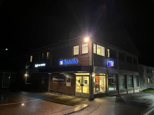 a building with a light on top of it at night at Cozy miniroom A in Åmot