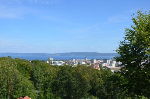a view of a city from a hill with trees at Svf Hotell & Konferens in Jönköping