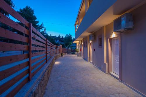a hallway of a building with a fence at Mary Elen Boutique Hotel in Argasi