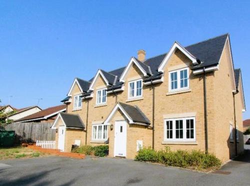 a large brick house with a lot of windows at Impeccable 2-Bed House in Basildon in Basildon