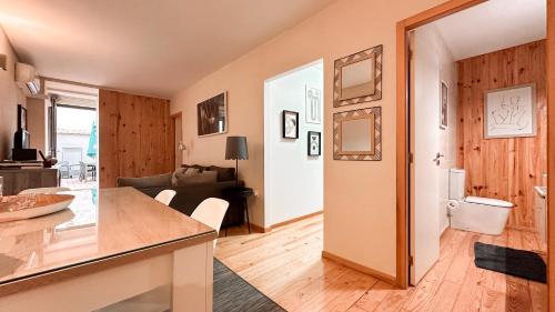 a kitchen and living room with a counter top and a room at Almada Apartments 468 in Porto