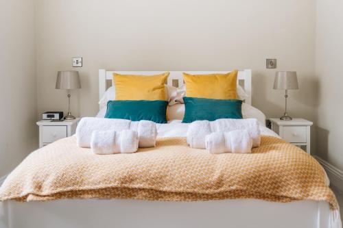 a bedroom with a bed with towels on it at The Old Granary in Barnetby le Wold