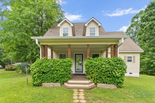 a house with two bushes in front of it at Lake Sinclair in Eatonton