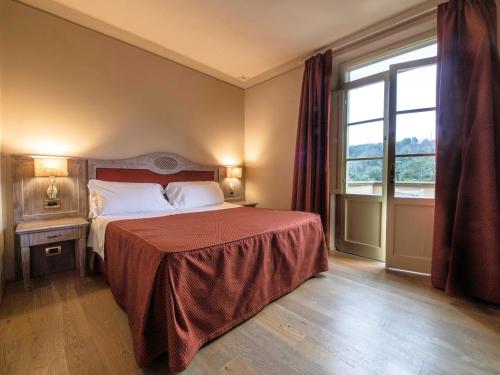 Ein Bett oder Betten in einem Zimmer der Unterkunft Relais I Piastroni