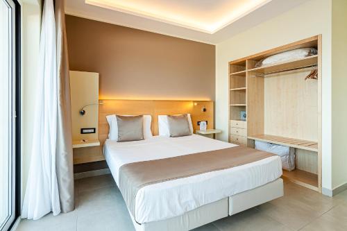 a bedroom with a large white bed in a room at Grand Hotel Santa Maria in Santa Maria di Castellabate