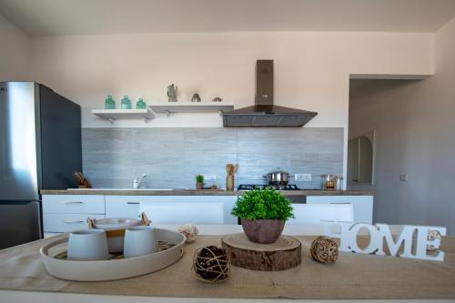 a kitchen with a table with two bowls on it at Pietra di Luna in Valledoria