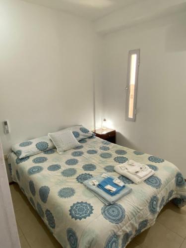 a bedroom with a bed with towels on it at Excelencia y ubicación in Resistencia
