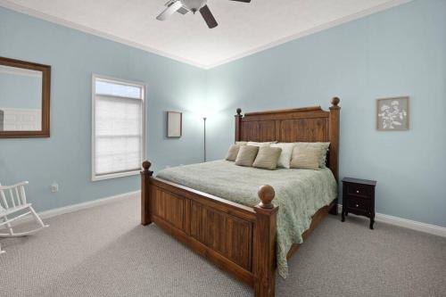 a bedroom with a bed and a ceiling fan at Fawn Run on Lake Cumberland in Nancy