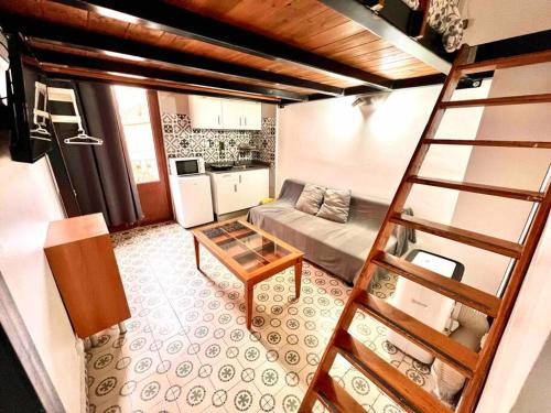 a living room with a couch and a table at P3 Estudio con cocina!Balcón privado! 2`del metro P3 in Barcelona