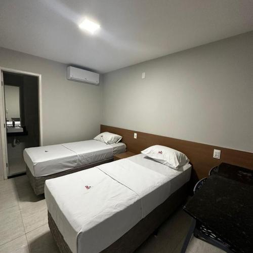 Ein Bett oder Betten in einem Zimmer der Unterkunft ONIX AGUAS CLARAS