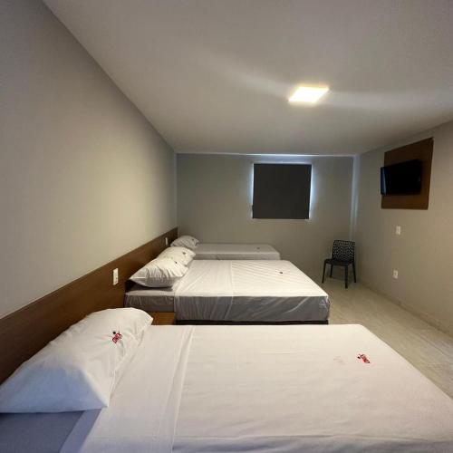 Posteľ alebo postele v izbe v ubytovaní ONIX AGUAS CLARAS