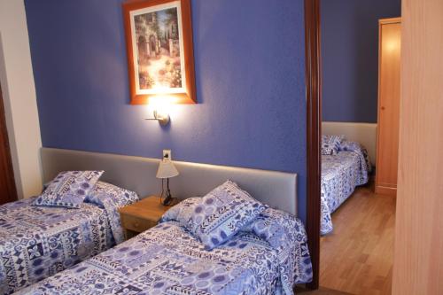 Postel nebo postele na pokoji v ubytování Hotel Parras Arnedillo