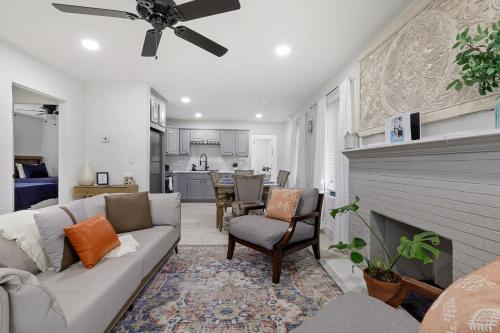 a living room with a couch and a fireplace at Summer Retreat House in Fort Lauderdale