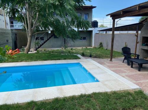 a swimming pool in the backyard of a house at La Casita Yogui - MONOAMBIENTE 1 in Santa Rosa de Calamuchita