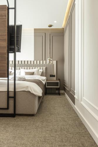 a bedroom with two beds and a window at RIVA sleep & chill in Valjevo